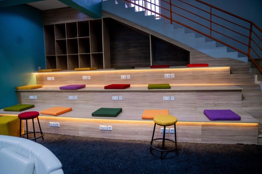 Inside a Nigerian university innovation hub with tiered seating and workspaces